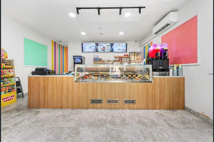 The Candy Cream ice cream display counter and colourful frozen drink machines
