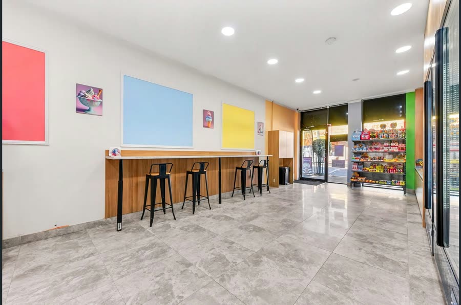 Candy Cream’s pastel seating area beside the store entrance